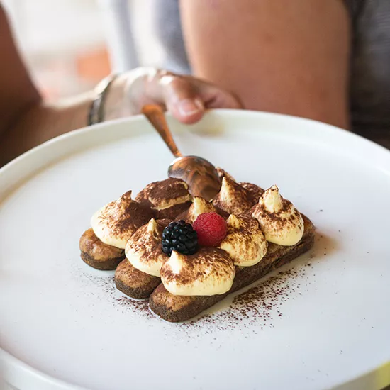 A plate of Italian Tiramisu, shaped like a square