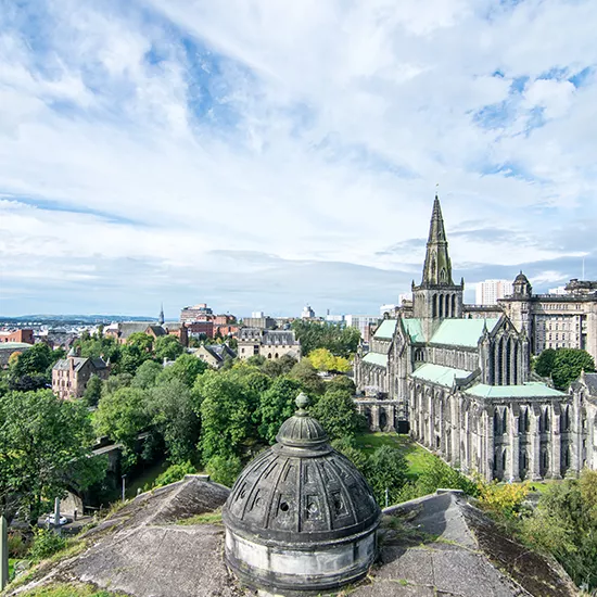 A landscape view of the city of Glasgow, Glasgow Cathedral featuring prominently in the background.