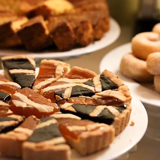 A selection of different Italian desserts and pastries adorn a table.